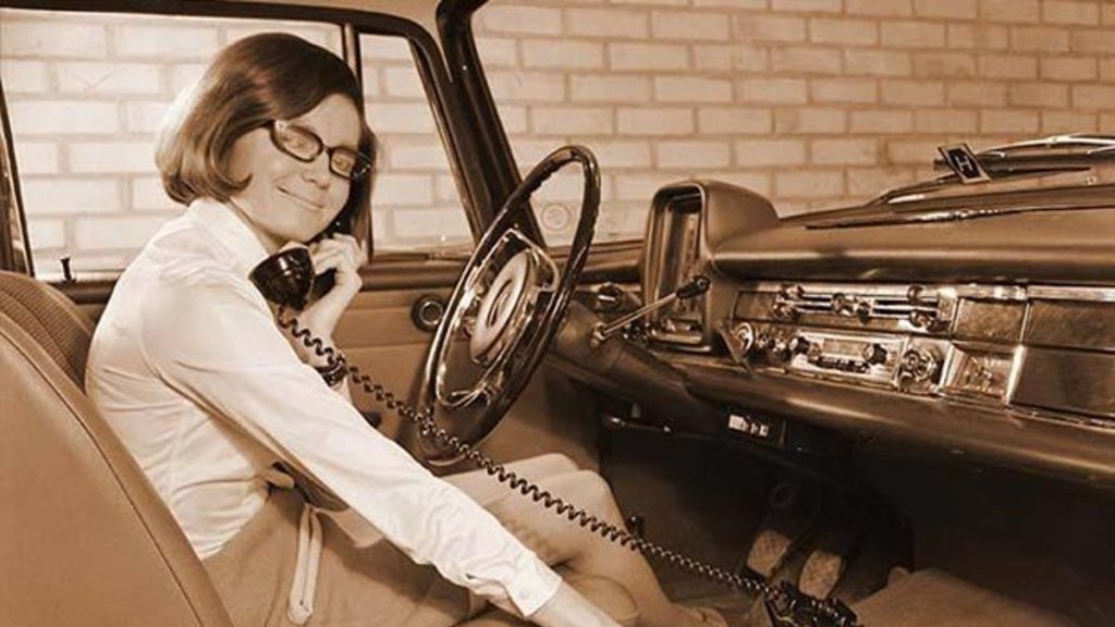 Early days of the car phone use.  No an extinct classic car feature