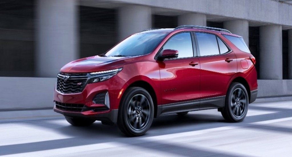 A red 2022 Chevrolet Equinox small SUV is parked.