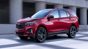 A red 2022 Chevrolet Equinox small SUV is parked.
