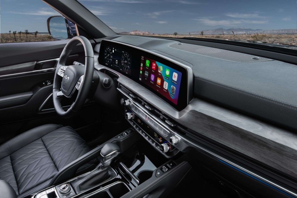Dashboard and driver's seat in 2023 Kia Telluride, highlighting its release date and price