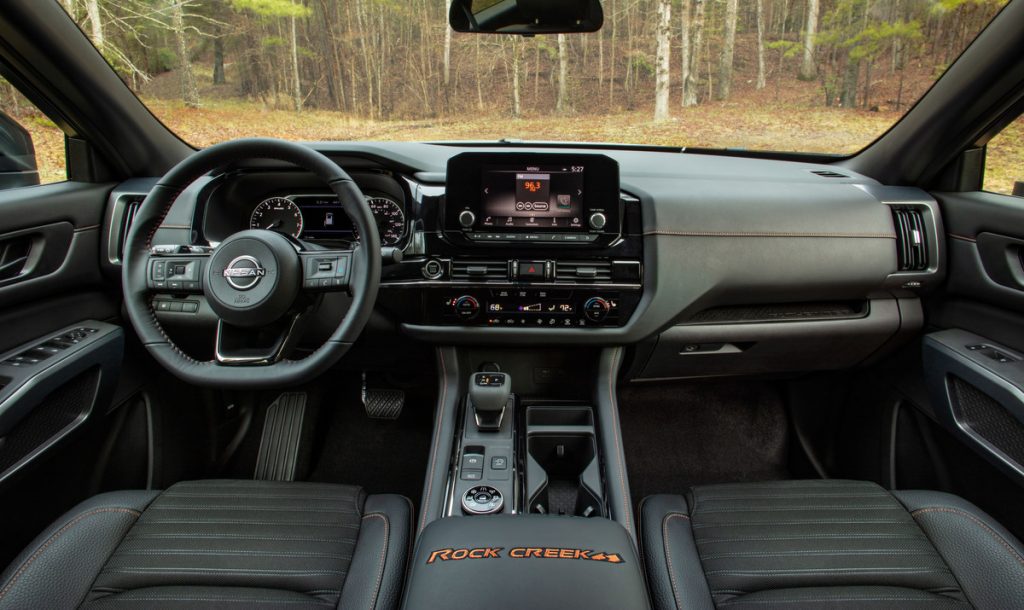 Dashboard and front seats in 2023 Nissan Pathfinder, highlighting its release date and price