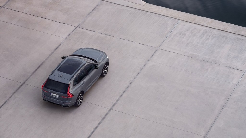 An exterior shot of the 2022 Volvo XC60 Recharge near a water feature.
