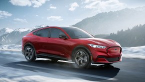 A red 2022 Ford Mustang Mach-E electric SUV.
