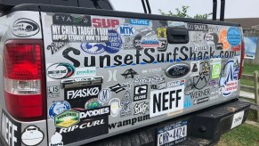 Ford truck with many bumper stickers, highlighting things that lower the resale value of a car