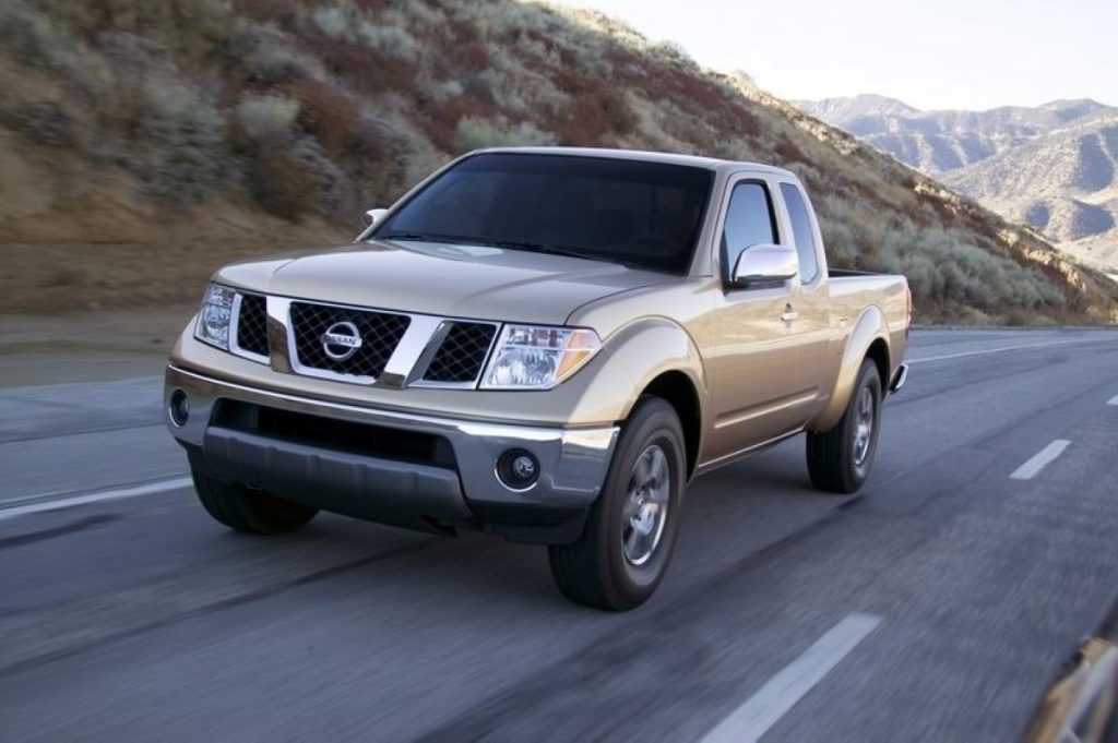 Front angle view of beige 2005 Nissan Frontier, an unreliable used 2000s pickup truck to avoid