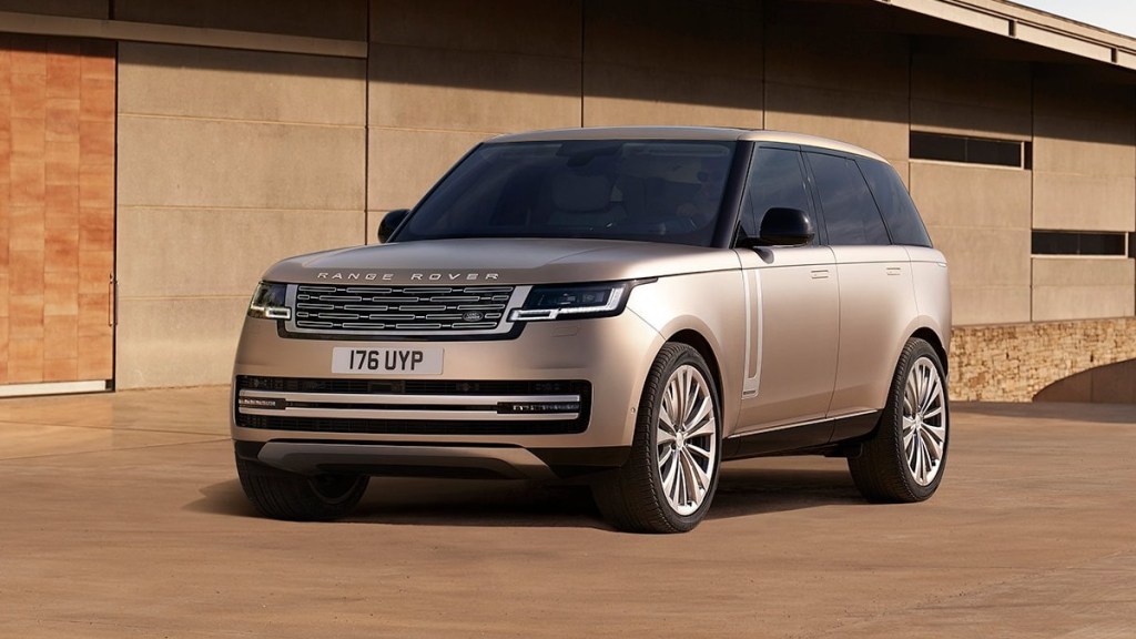 Front angle view of beige Land Rover Range Rover, a luxury SUV that can be ordered as a hybrid and has off-road capability.  
