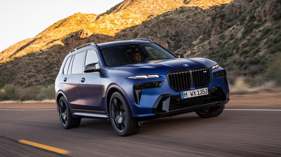 Front angle view of blue 2023 BMW X7, highlighting its release date and price