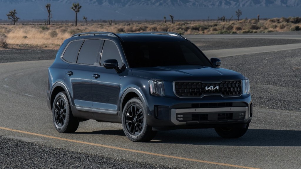 Front angle view of blue 2023 Kia Telluride, highlighting its release date and price