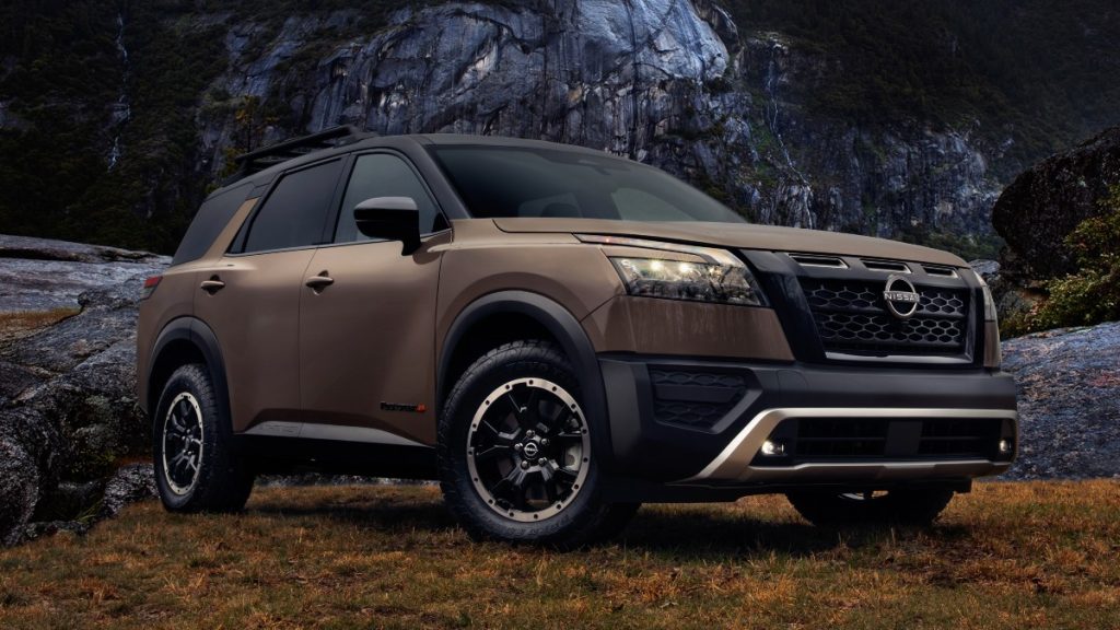 Front angle view of bronze 2023 Nissan Pathfinder, highlighting its release date and price