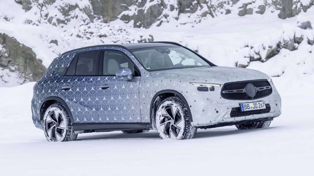 Front angle view of camouflaged 2023 Mercedes-Benz GLC-Class, highlighting its release date and price