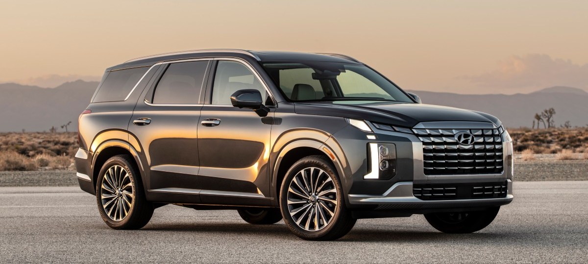 Front angle view of dark gray 2023 Hyundai Palisade, highlighting its release date and price