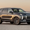 Front angle view of dark gray 2023 Hyundai Palisade, highlighting its release date and price