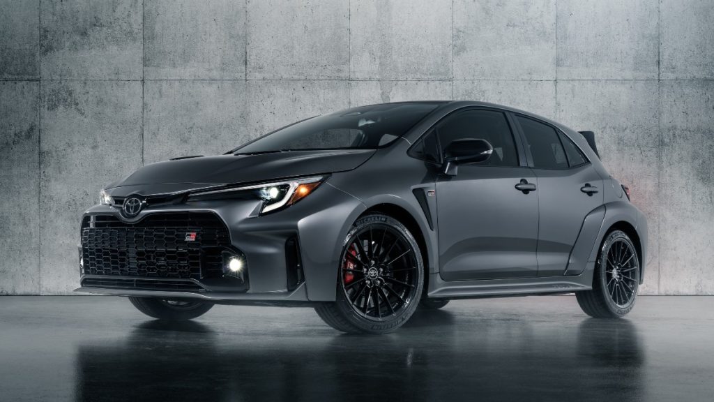 Front angle view of dark gray 2023 Toyota GR Corolla, highlighting its release date and price