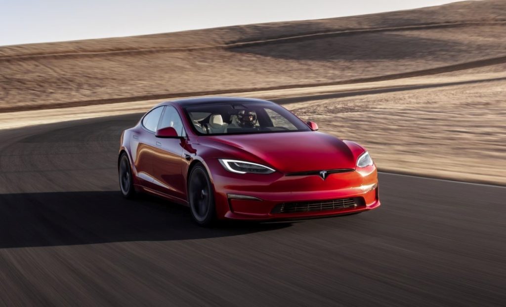 Front view of red Tesla model S Plaid, a fast car with one of the fastest quarter-mile acceleration times