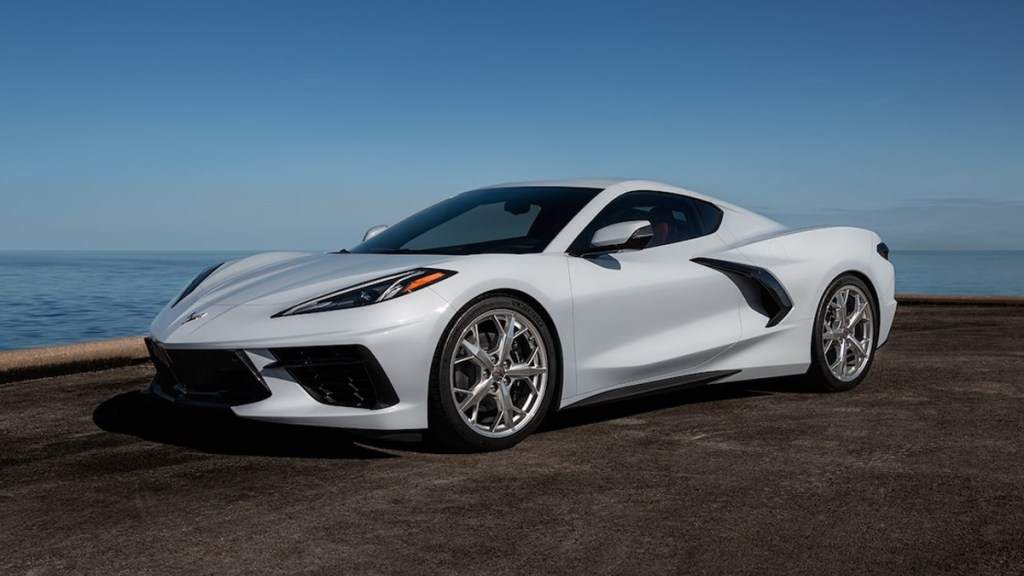 Front angle view of white 2022 Chevy Corvette, highlighting the release date and price of the 2025 Chevy Corvette EV