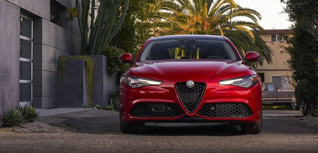 Front view of red 2022 Alfa Romeo Giulia, a car that is a big waste of money