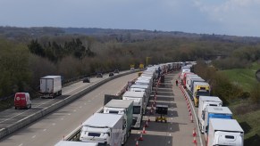 Semi trucks are backed up along a highway, What is the #NoTruckstoColorado TikTok Trend?