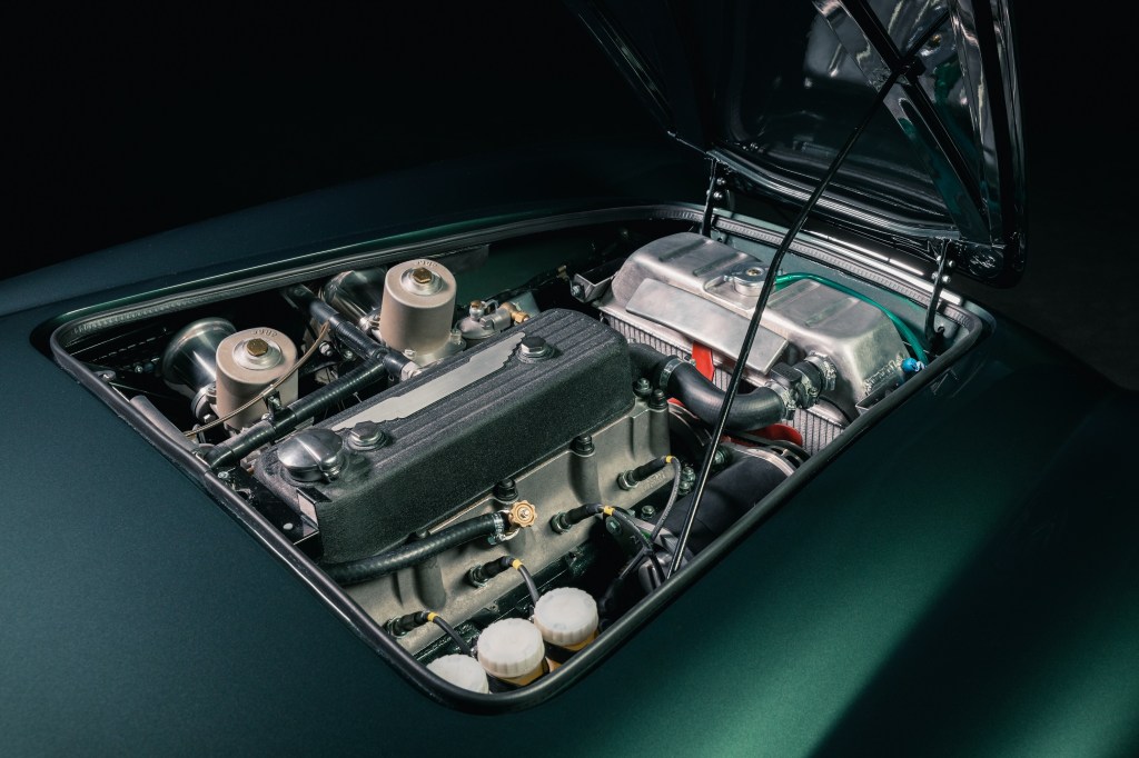 A dark-green Healey by Caton's 3.0-liter four-cylinder engine seen from the open hood