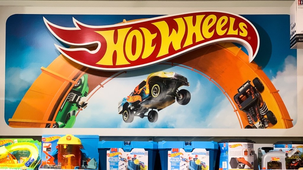 Hot Wheels sign and cars at a store, highlighting Colorado man that has a collection of over 30,000 Hot Wheels cars