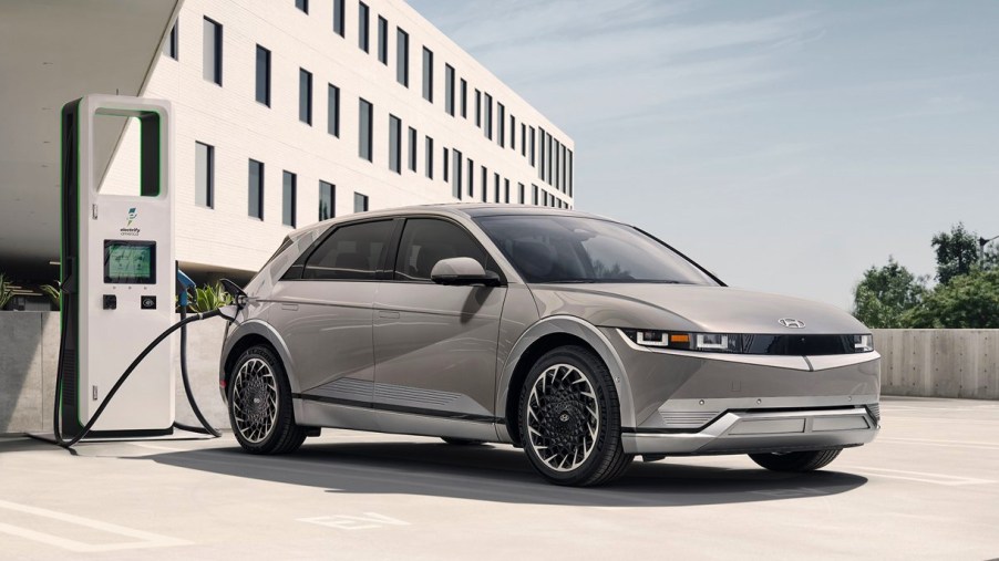 A gray 2022 Hyundai Ioniq 5 small SUV is charging.