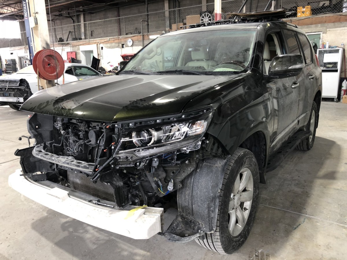 The front end of the Lexus has to come off for the Prado bits to fit.