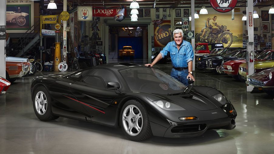 Jay Leno and his 1994 McLaren F1 in a car garage