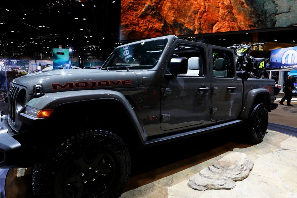 A grey Jeep Gladiator in an indoor environment.