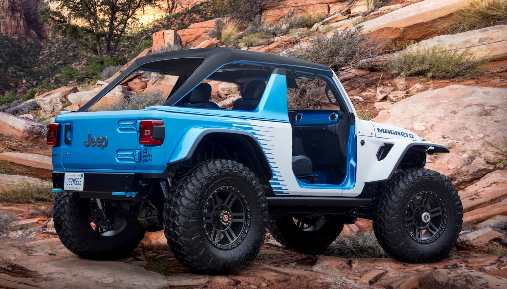 An electric Jeep concept vehicle parked on a rocky mountainside.