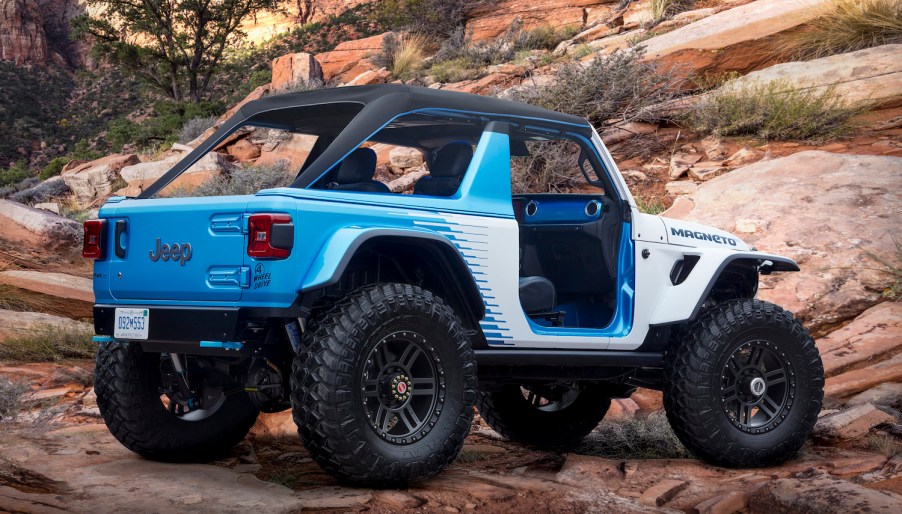 An electric Jeep concept vehicle parked on a rocky mountainside.