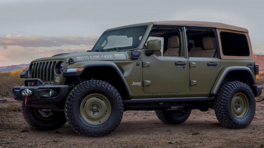 Khaki green, retro Jeep Wrangler plug-in hybrid concept car parked in the desert.