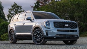 A gray 2022 Kia Telluride midsize SUV is parked outdoors.