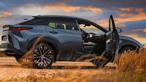 A gray Lexus RX 450e electric SUV is parked.