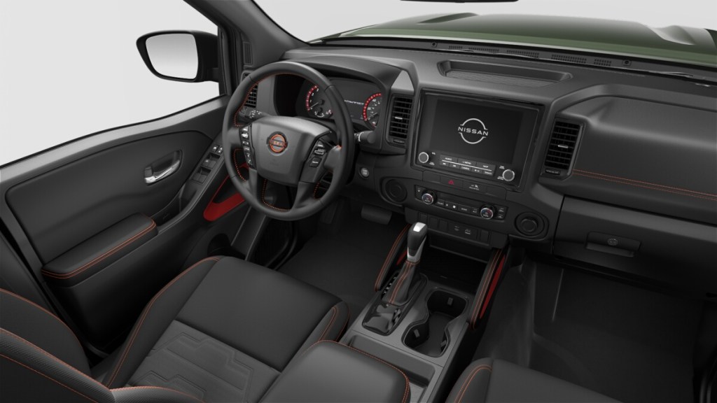 An interior shot of the Nissan Frontier mid-size truck, it mixes old-school and modern.