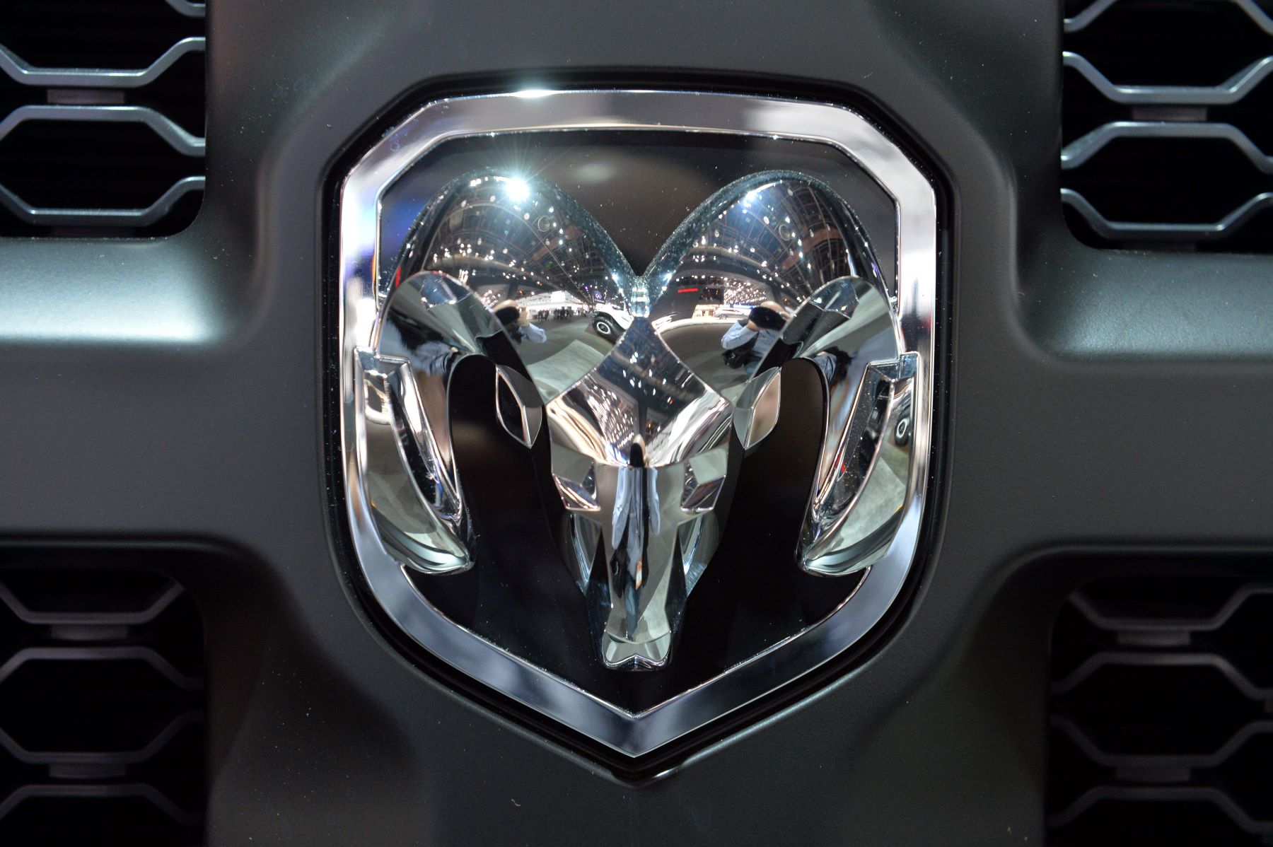 The Ram logo on the front of a truck grille
