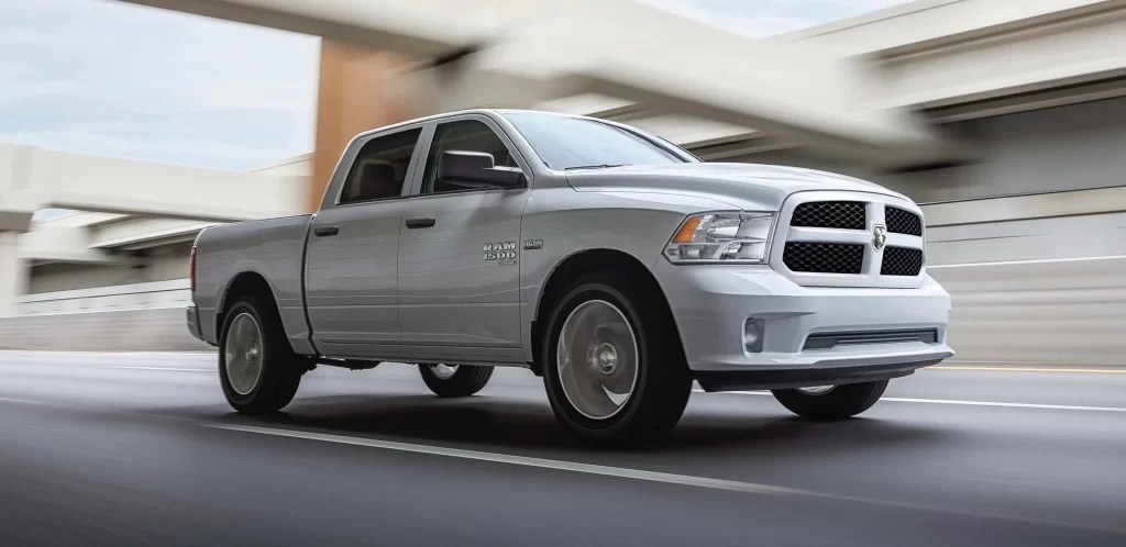 A silver Ram 1500 Classic shows off its styling as an old-school pickup truck.