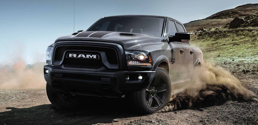 A 2022 Ram 1500 Classic shows off some off-road capability as a full-size truck. It wears grey paint.