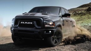A 2022 Ram 1500 Classic with racing stripes shows off some off-road capability as a full-size truck.