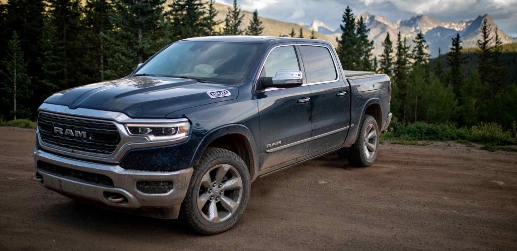 A 2022 Ram 1500 truck sits in front of mountainous terrain.