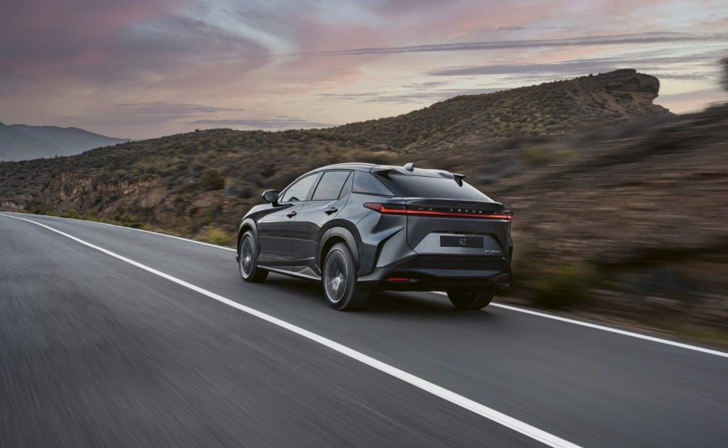 Rear angle view of gray 2023 Lexus RZ, highlighting its release date and price