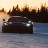 Front Rimac Nevera electric hypercar driving in the snow