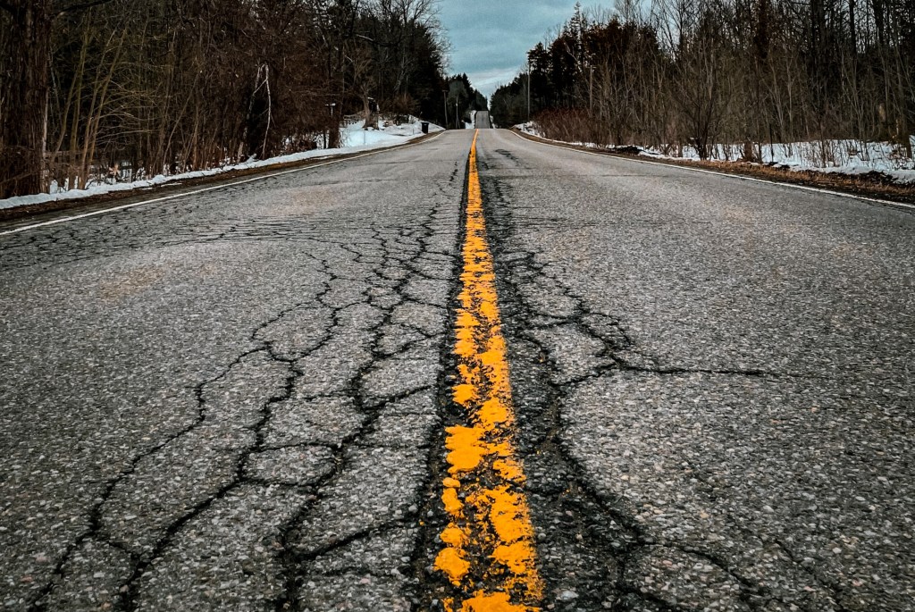 Road with cracks that need to be filled with tar