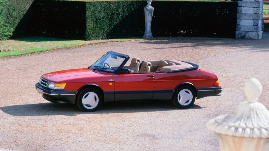 Red Saab 900 Turbo parked in a courtyard