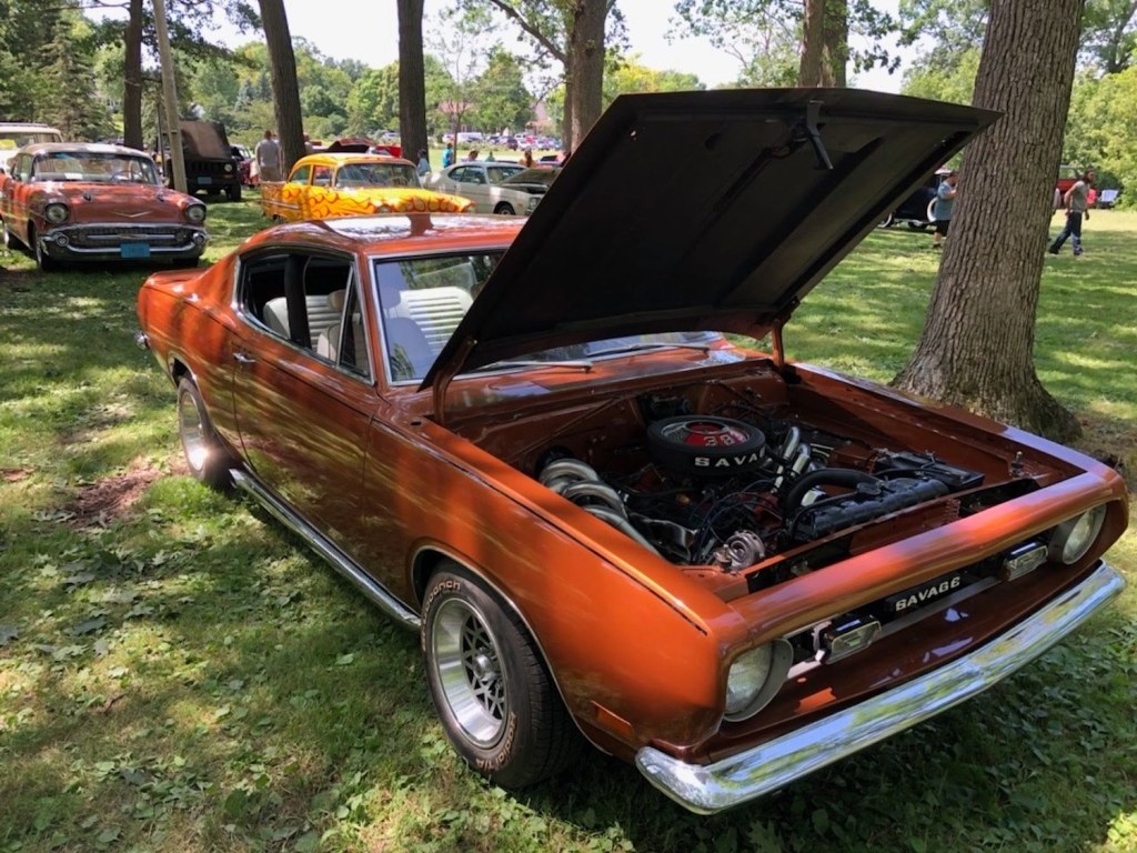 Copper colored Savage GT muscle car built by AutoCraft at a car show.