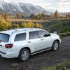 A white 2022 Toyota Sequoia driving in front of mountains.