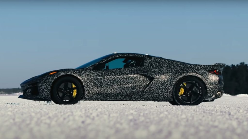 Side view of camouflage-wrapped 2023 Chevy Corvette E-Ray, highlighting its release date and price