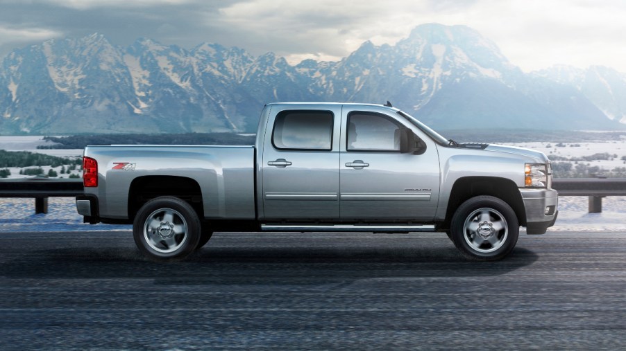 Side view of silver 2007 Chevy Silverado, an unreliable used 2000s pickup truck to avoid