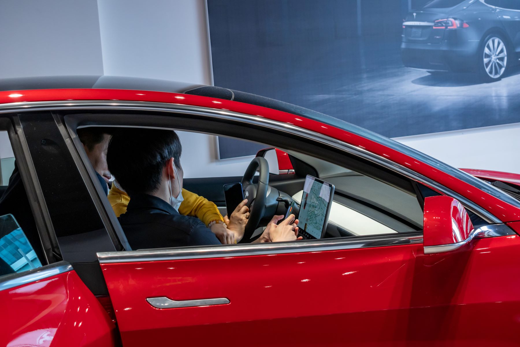 The Tesla Model 3 in a Shanghai Tesla Center, the only electric car to not get a positive noise rating from Consumer Reports