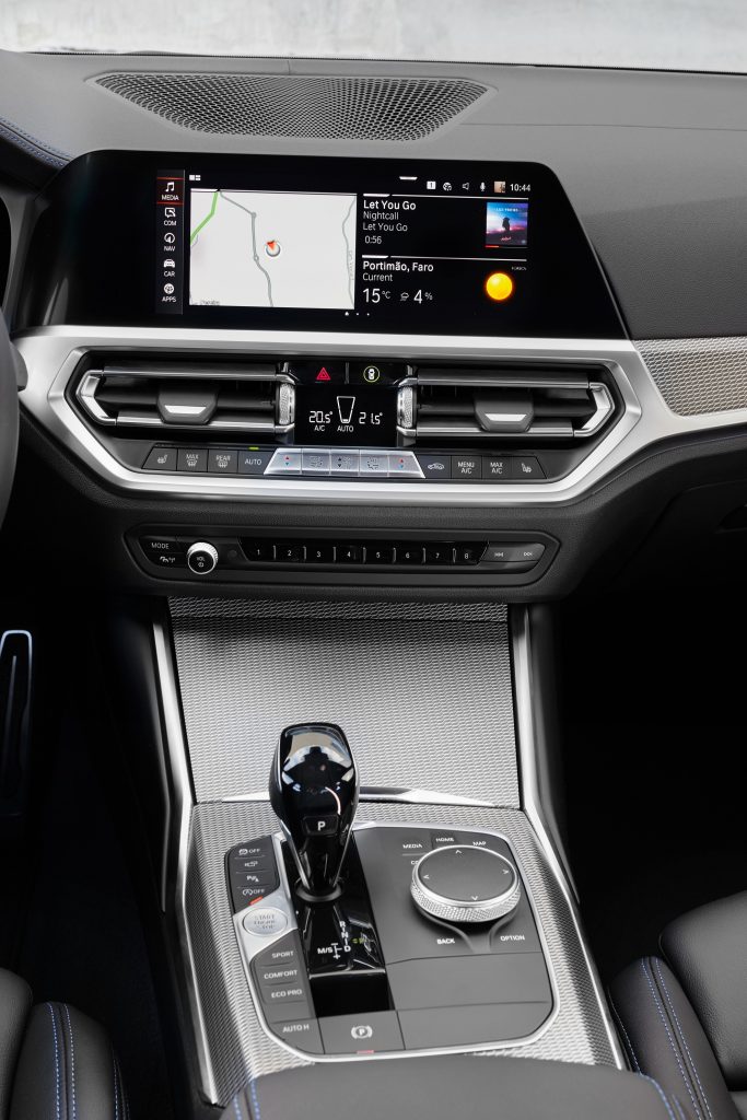 The 2022 BMW 3 Series' silver center console in a 330i M Sport