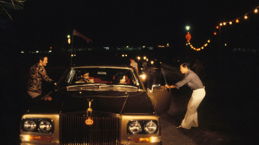 The sultan of Brunei getting into a Rolls-Royce
