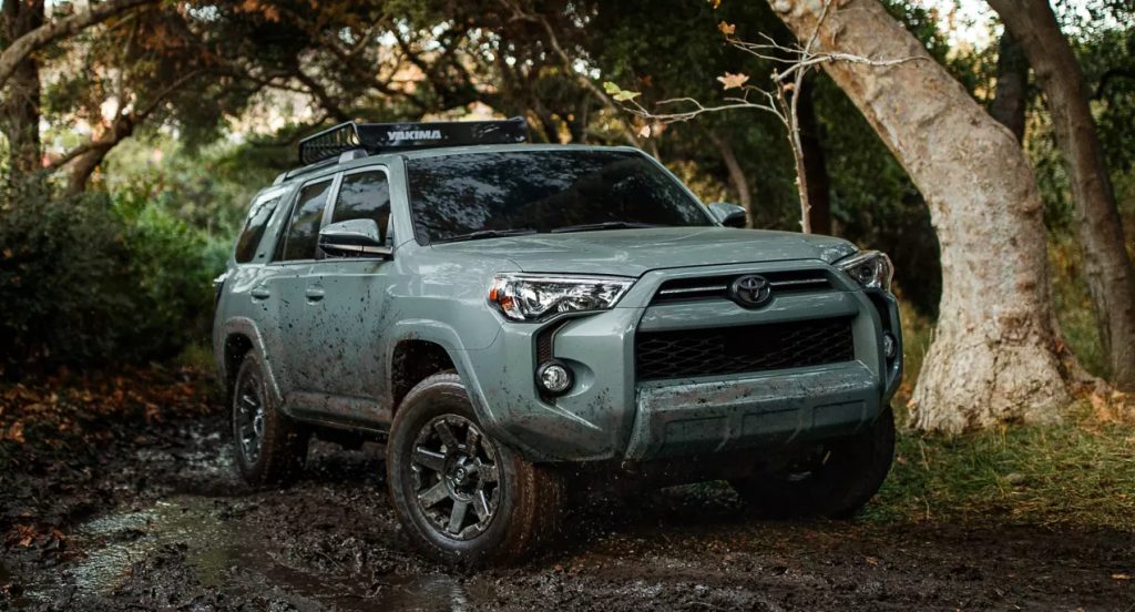 A green 2022 Toyota 4Runner is parked off-road. 